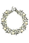 large statement necklace beaded with shiny pearls and glass crystals.