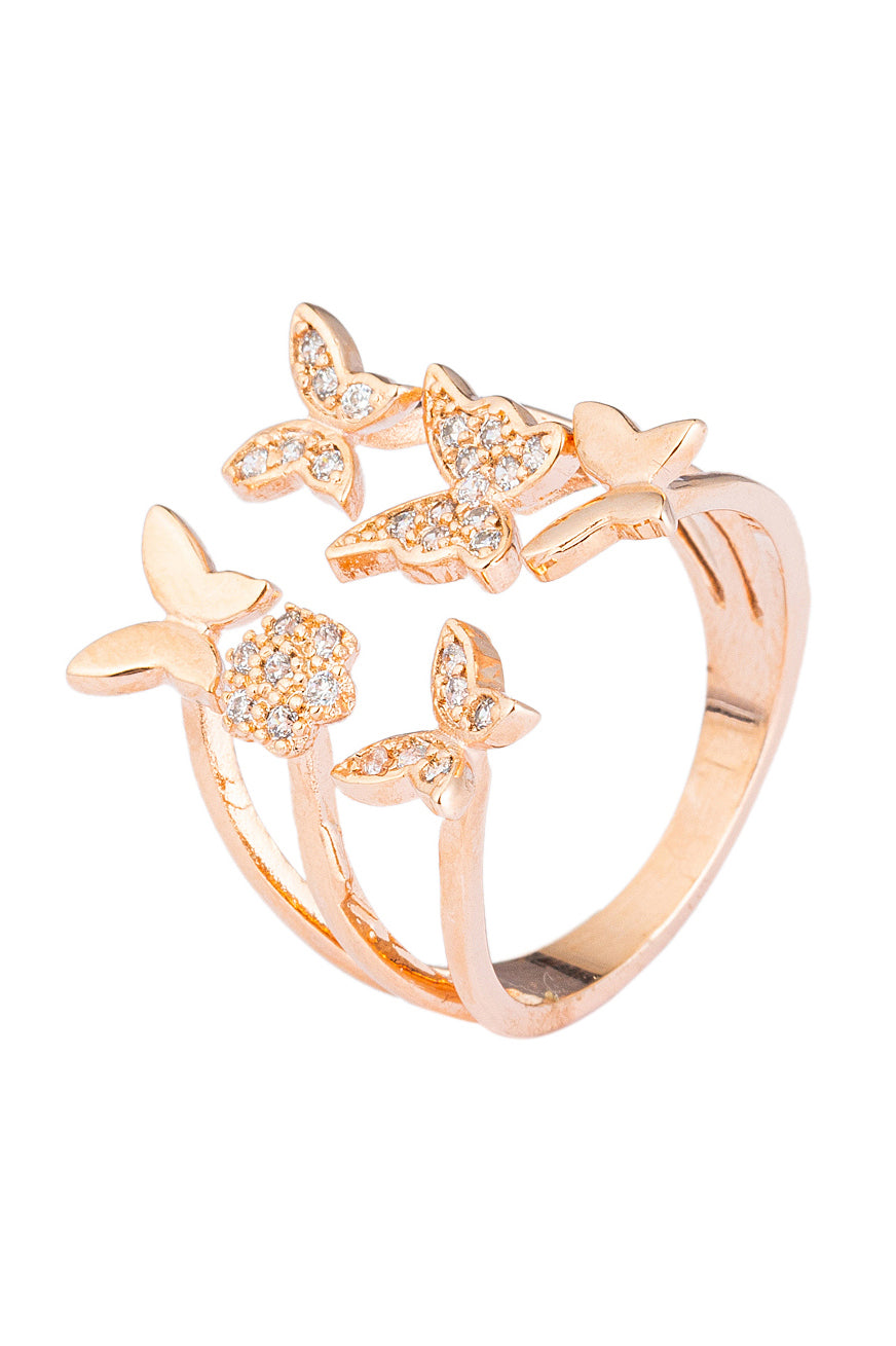 Fluttering butterflies ring studded with layered CZ crystals.