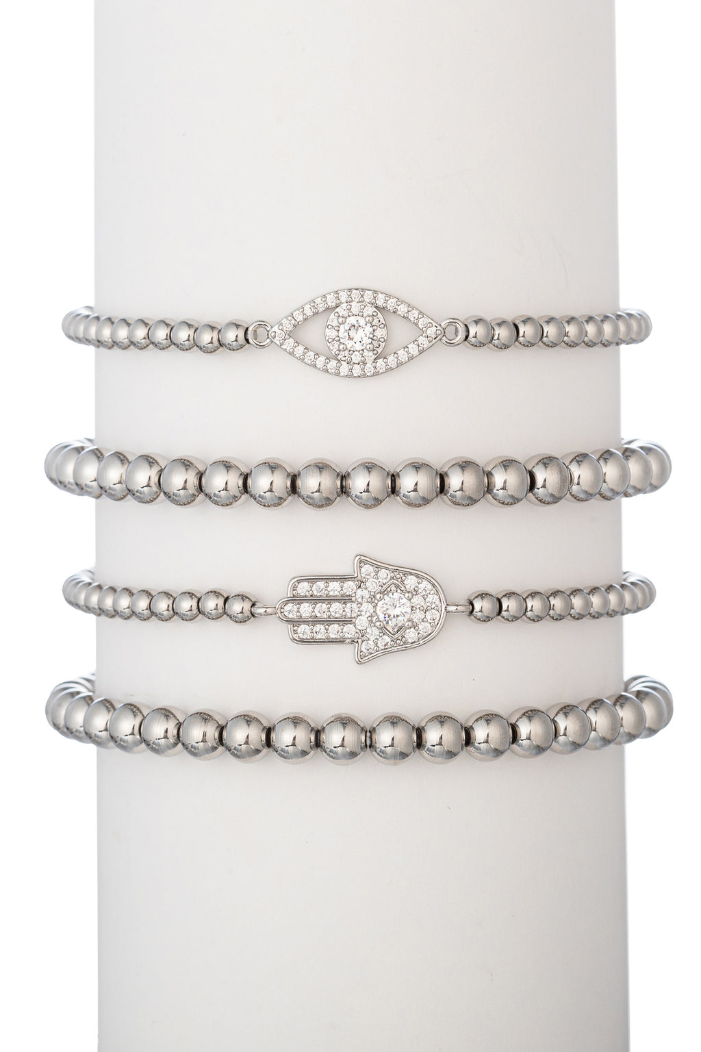 Silver tone titanium beaded bracelet set with CZ crystal evil eye and hamsa hand pendants.