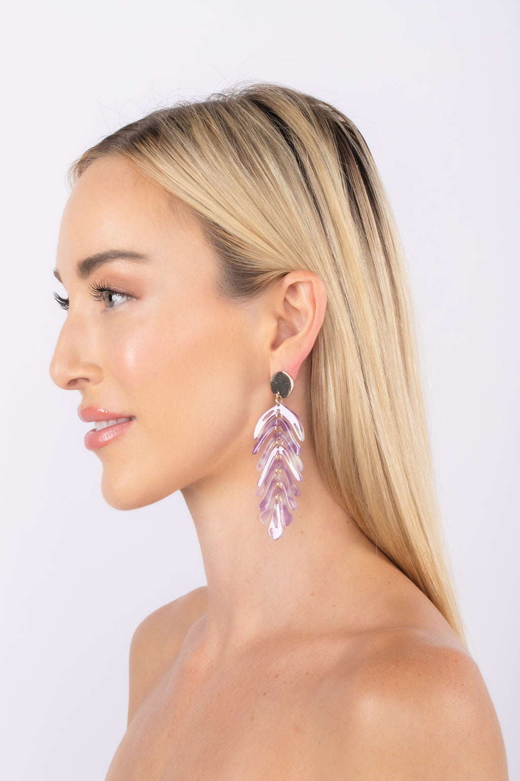 Gold alloy acrylic leaf pendant earrings.