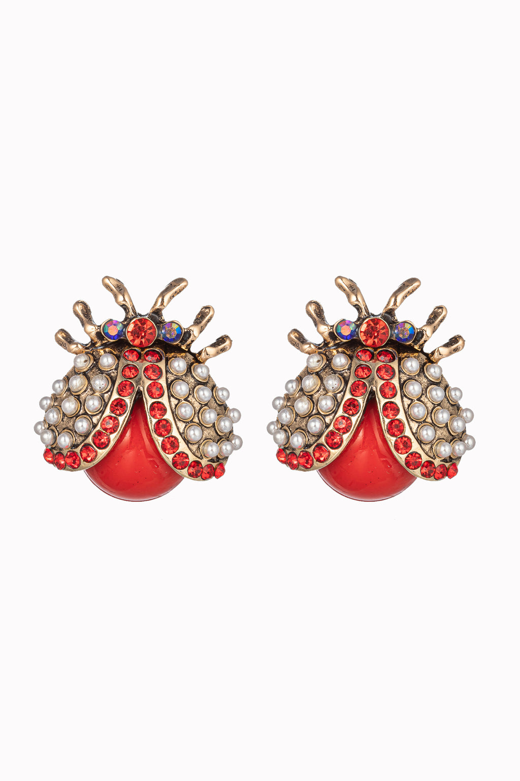Gold tone alloy red beetle stud earrings with red glass crystals.