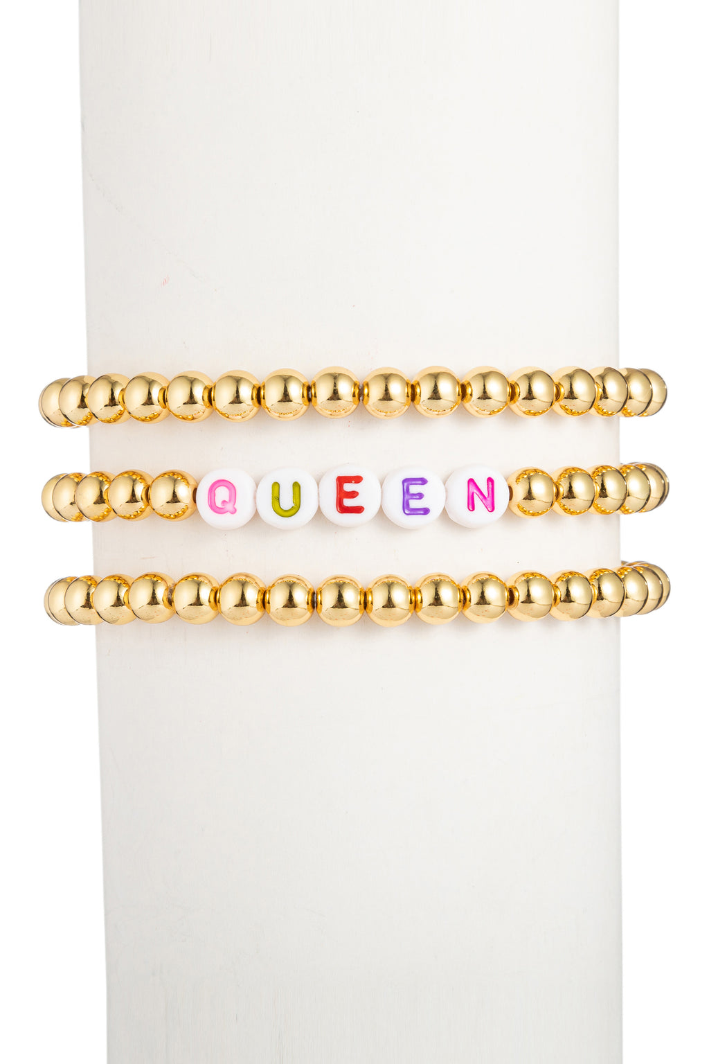 Gold tone titanium beaded bracelet set with "QUEEN" spelled beads.