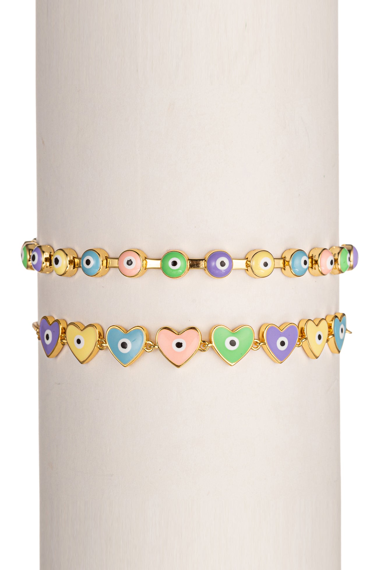 Gold tone brass bracelet set with pastel colored enamel heart & eye pendants.