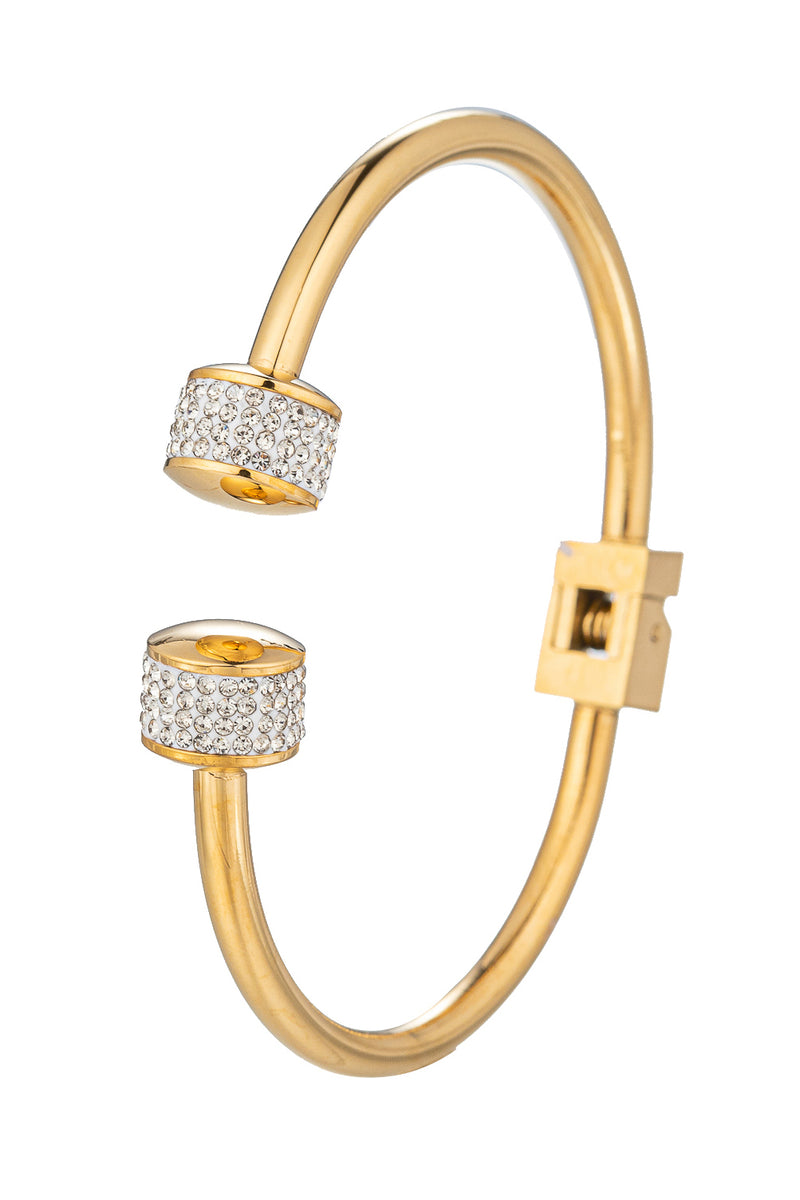 Gold tone titanium cuff bracelet studded with CZ crystals.