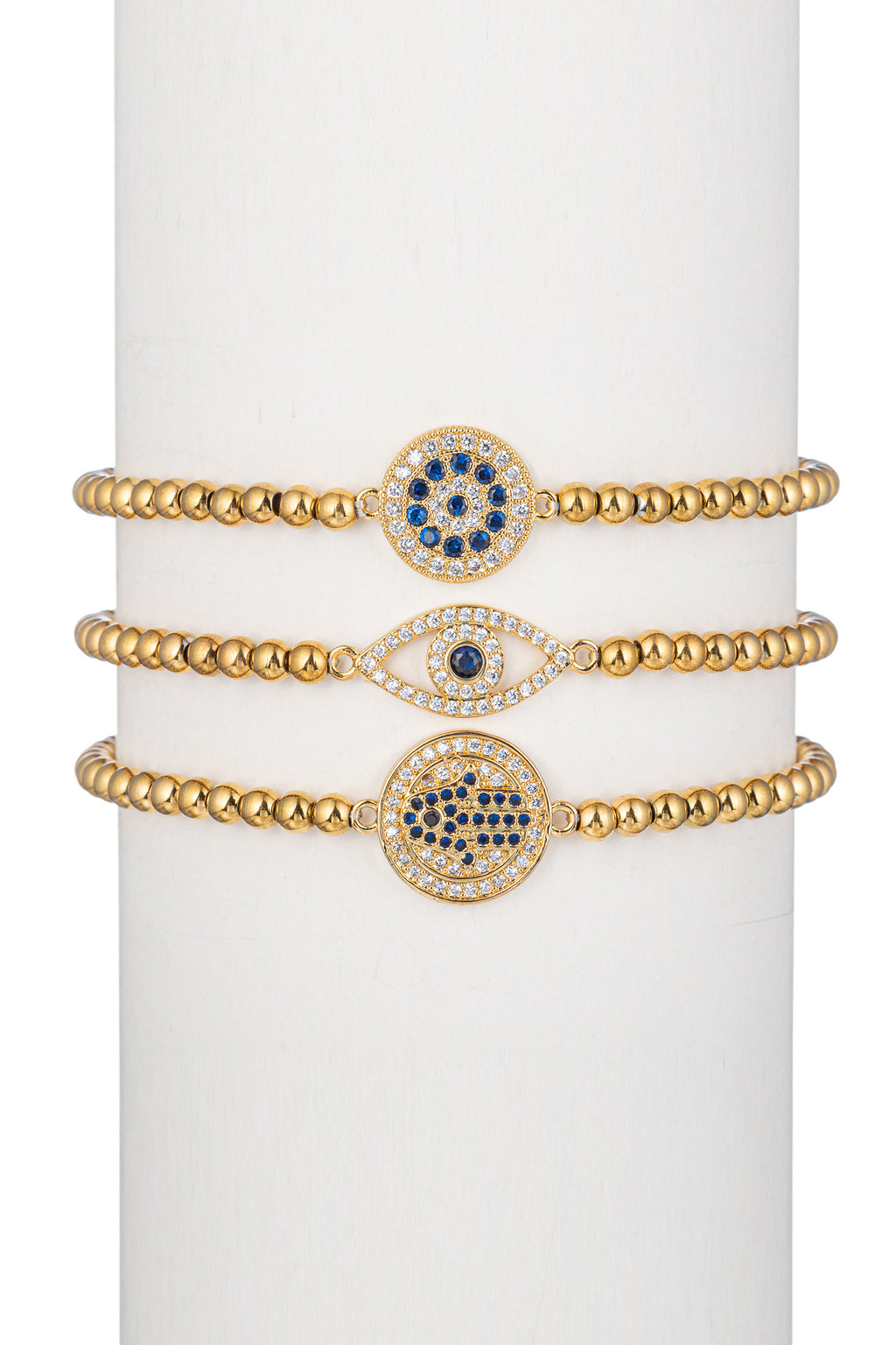 Gold titanium beaded bracelet set with CZ crystal studded brass pendants.