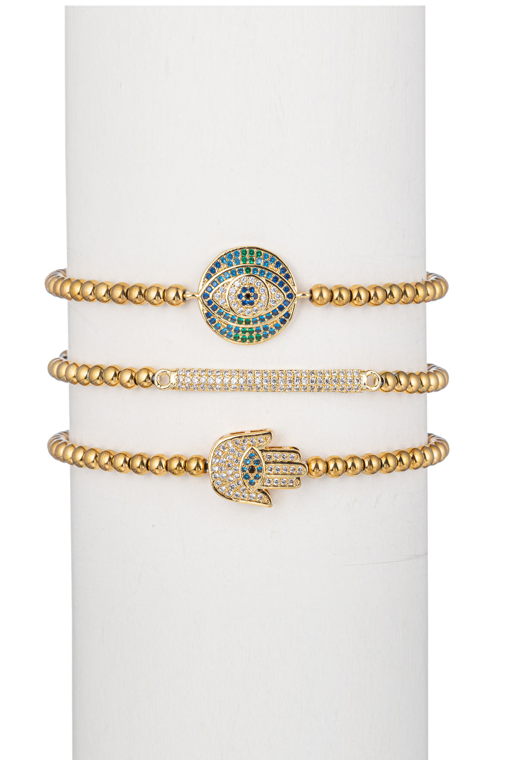 Gold titanium hamsa and evil eye beaded bracelet set studded with CZ crystals.