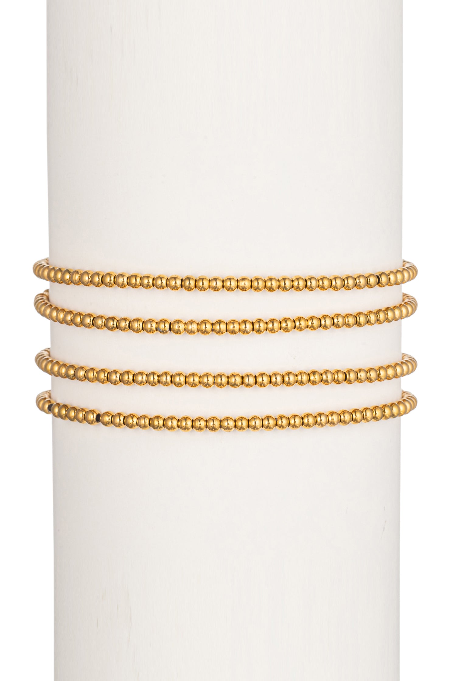 Gold tone titanium 3mm stretch band beaded bracelet set.