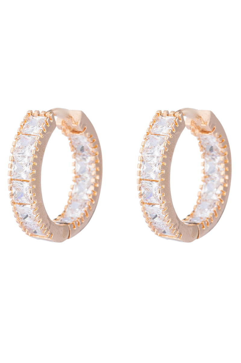 Gold huggie earrings studded with CZ crystals.