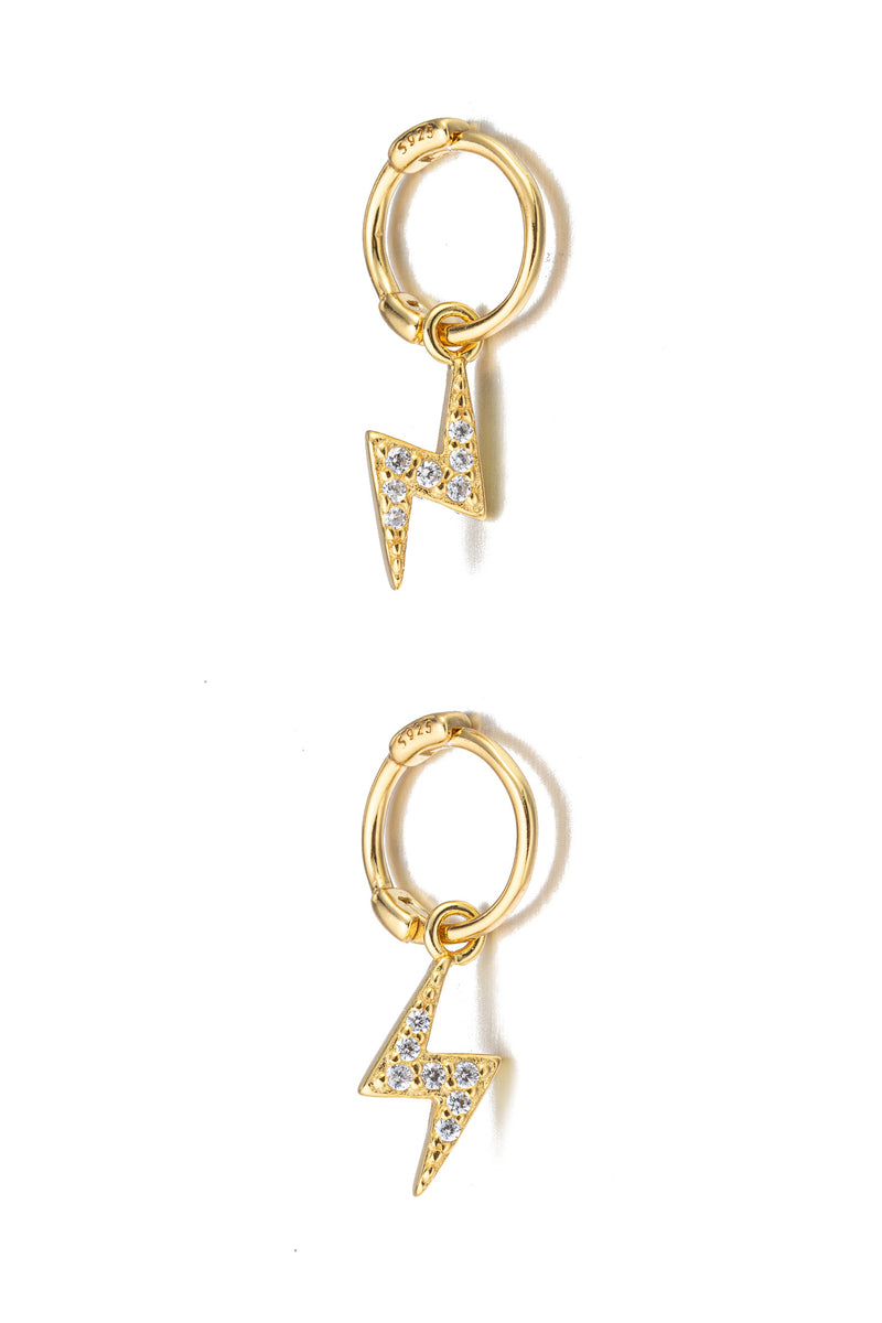 Gold sterling silver lightning bolt huggie earrings.