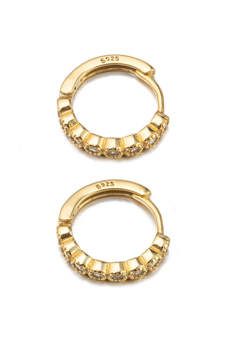 Gold sterling silver huggie earrings with CZ crystals.