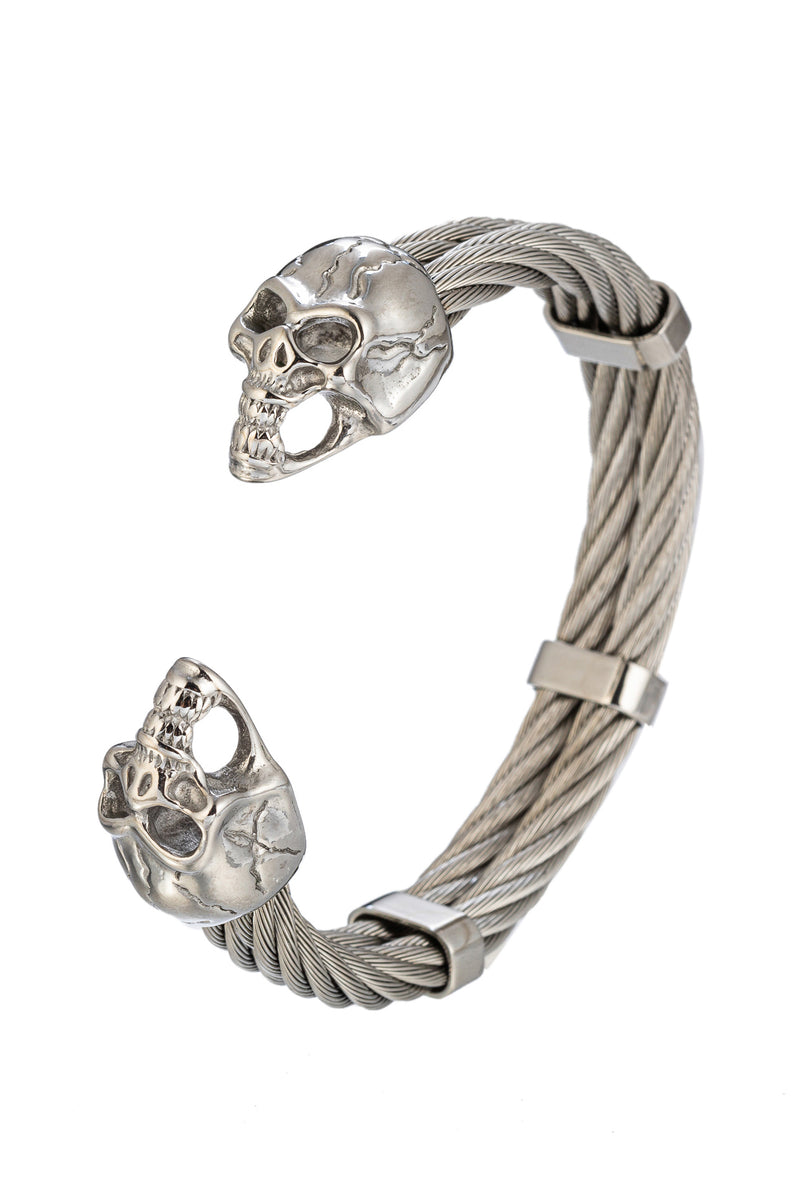 Silver tone titanium skull cuff bracelet.