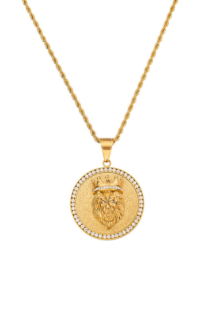Gold tone titanium lion head circle pendant necklace studded with CZ crystals.