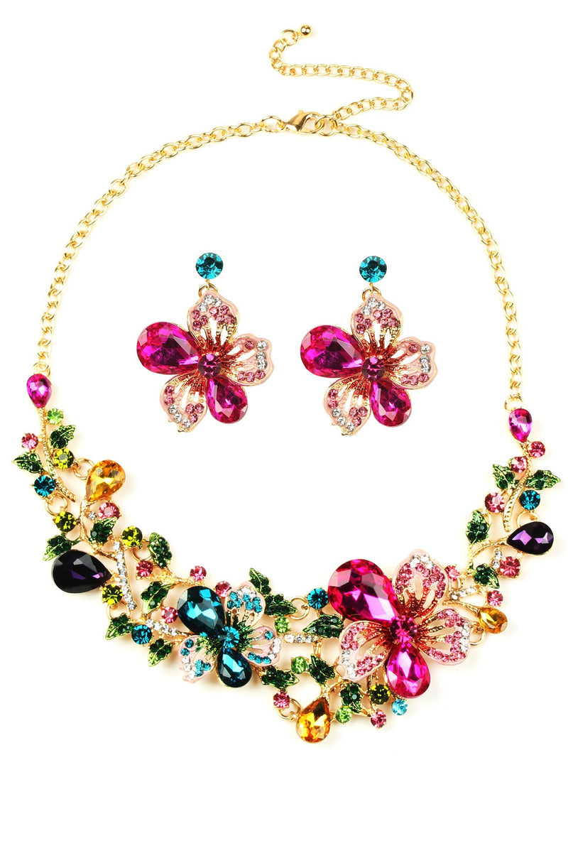 Necklace and earring set. Approximately 14 inch gold Necklace with colorful pink and blue floral design. Earrings featured are approximately 2" in size and feature light pink and magenta crystal petals. 