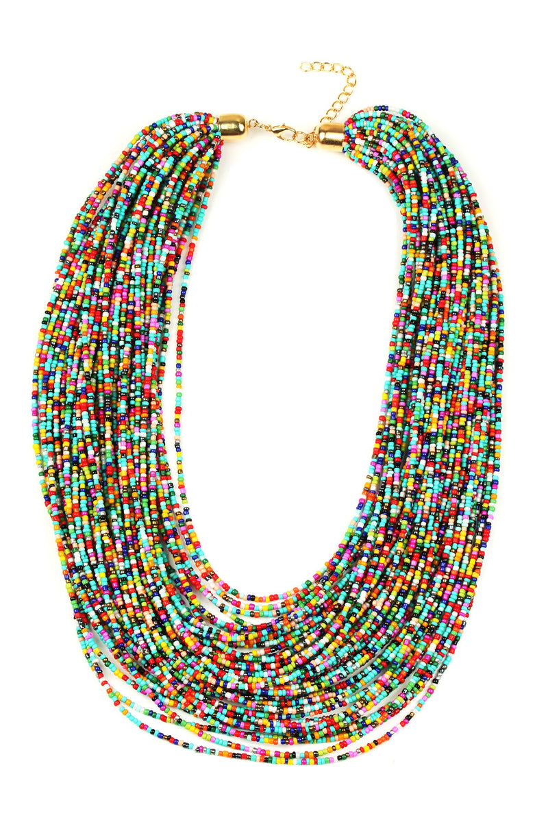 Large statement necklace composed of many layered chains. Chains feature a variety of small colored beads.
