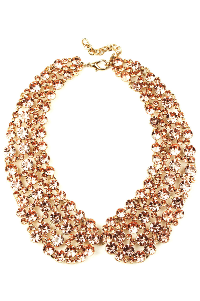 12 inch rose gold collar necklace with circular blush crystals arranged in collar pattern.