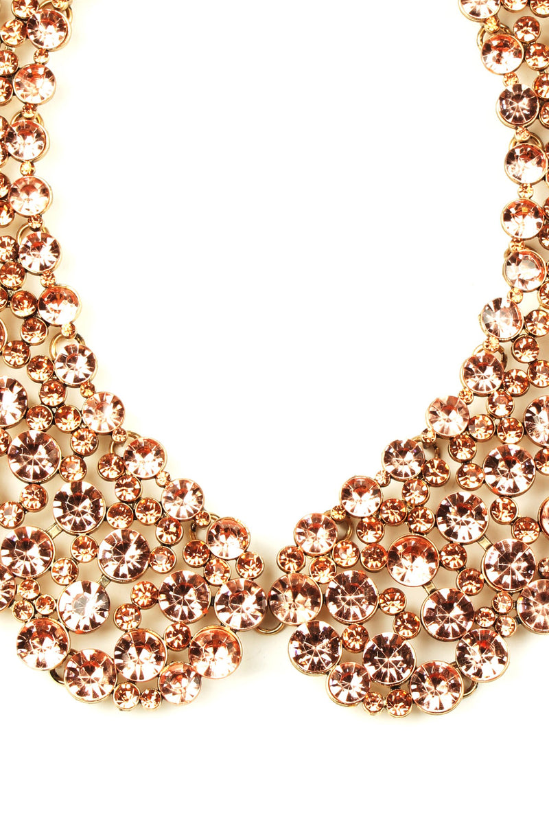 Close up of rose gold crystal collar necklace