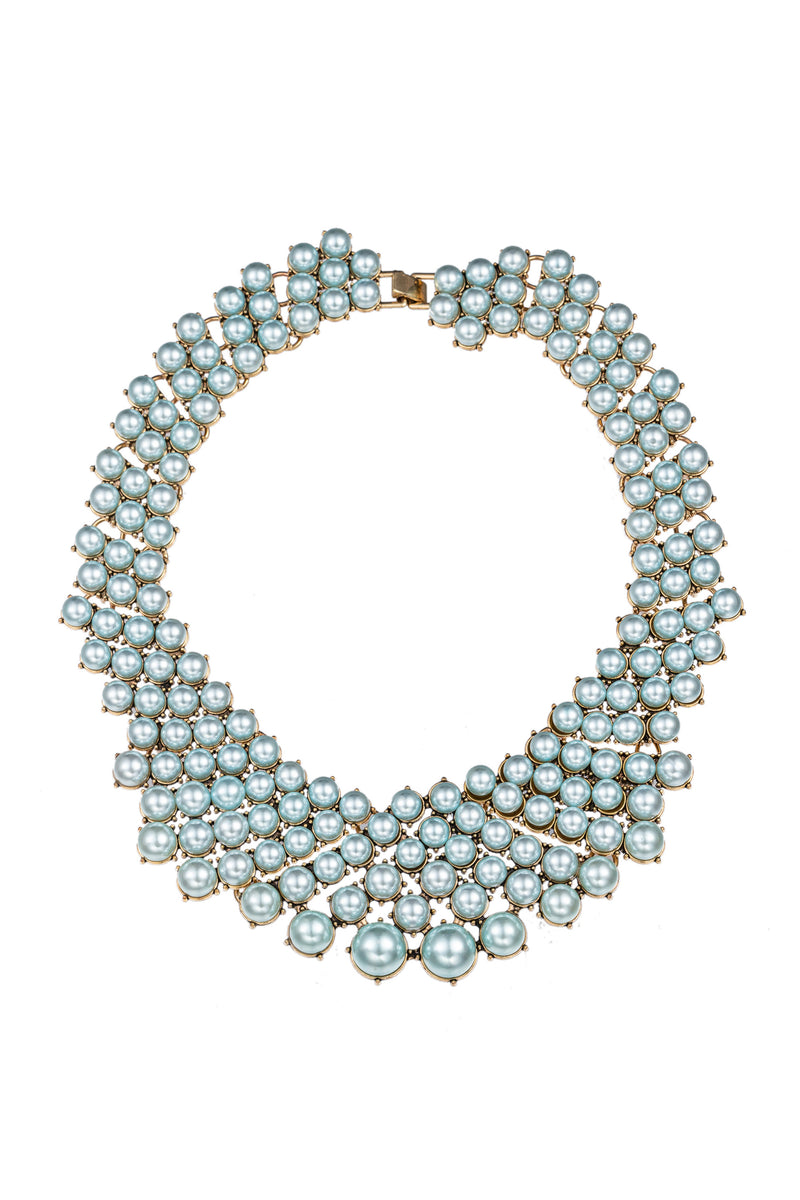 Teal alloy statement necklace studded with glass crystals.