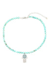 Teal agate stone beaded necklace with a CZ crystal hamsa hand pendant.