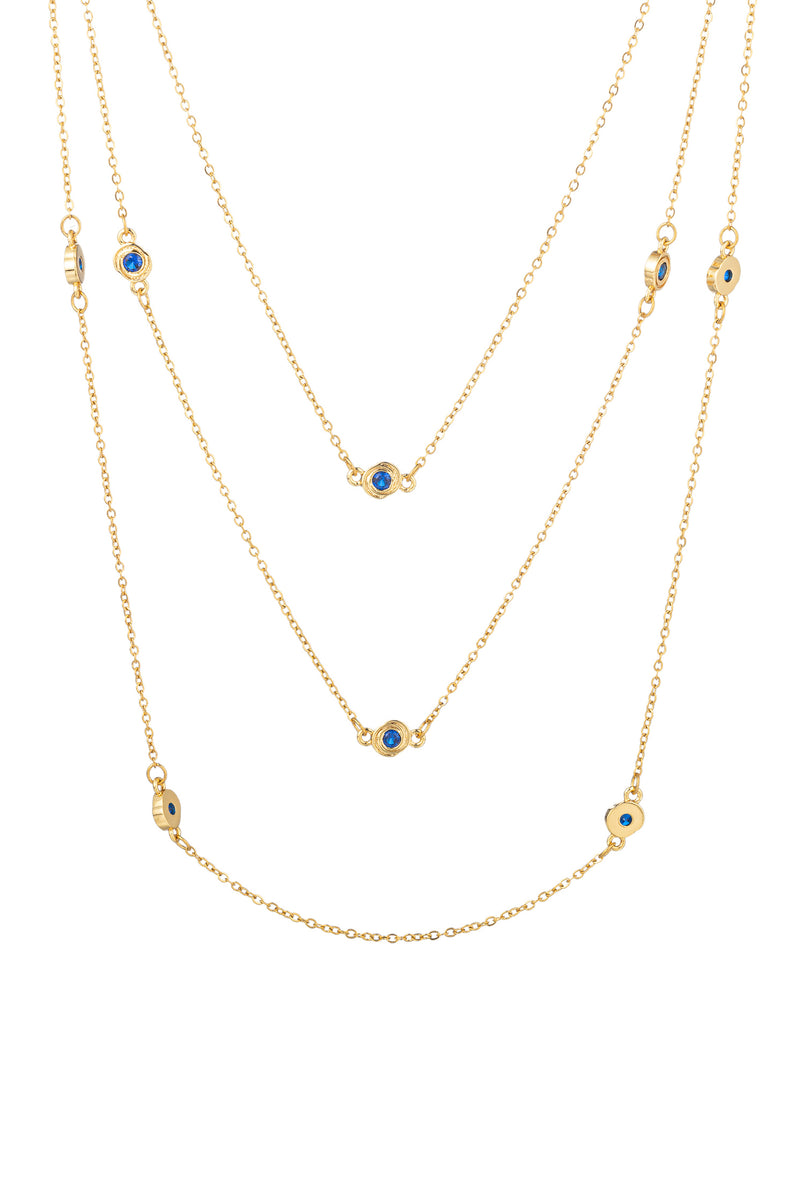 Gold tone brass 3-piece necklace set studded with blue CZ crystals.