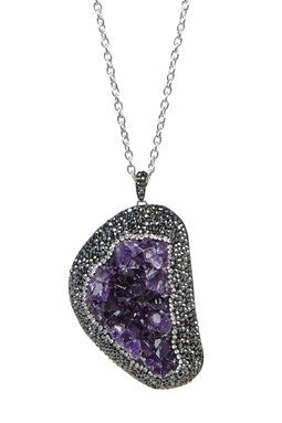 Rhinestone necklace with an amethyst stone pendant.