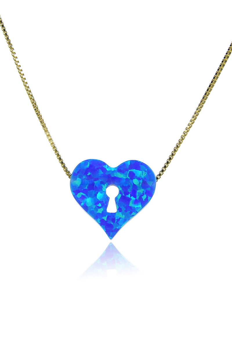 Thin gold chain necklace with blue heart pendant made of opal stone. Heart pendant features keyhole cutout.