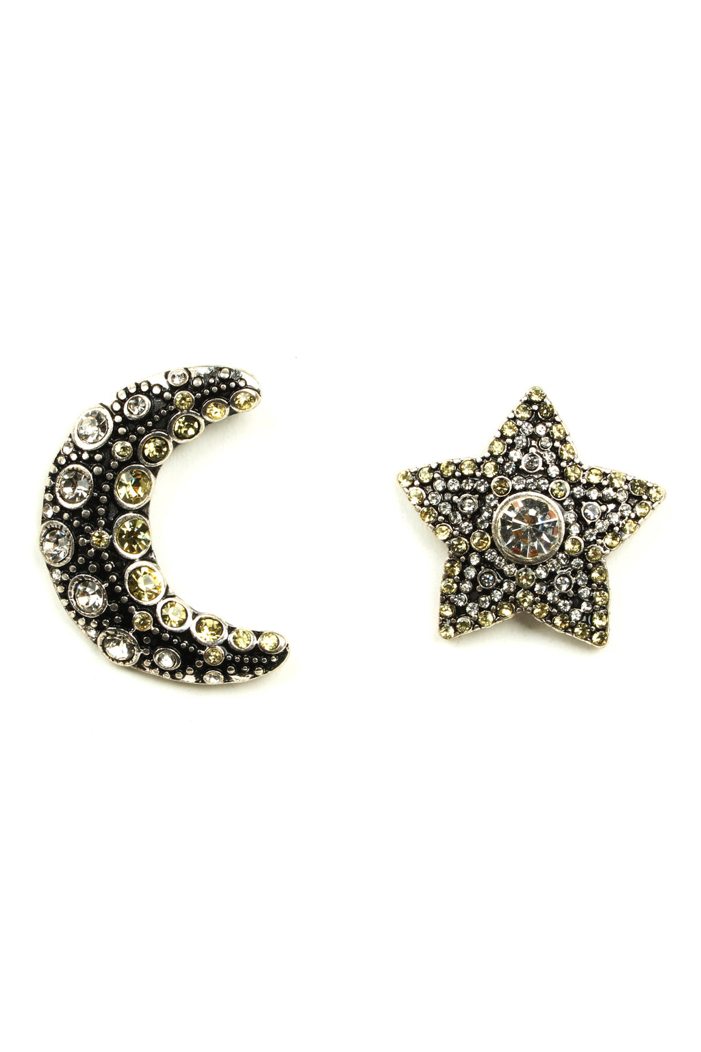 Metallic silver star & crescent moon stud earrings studded with glass crystals.