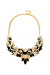 Gold tone alloy golden wing necklace with black glass crystals.