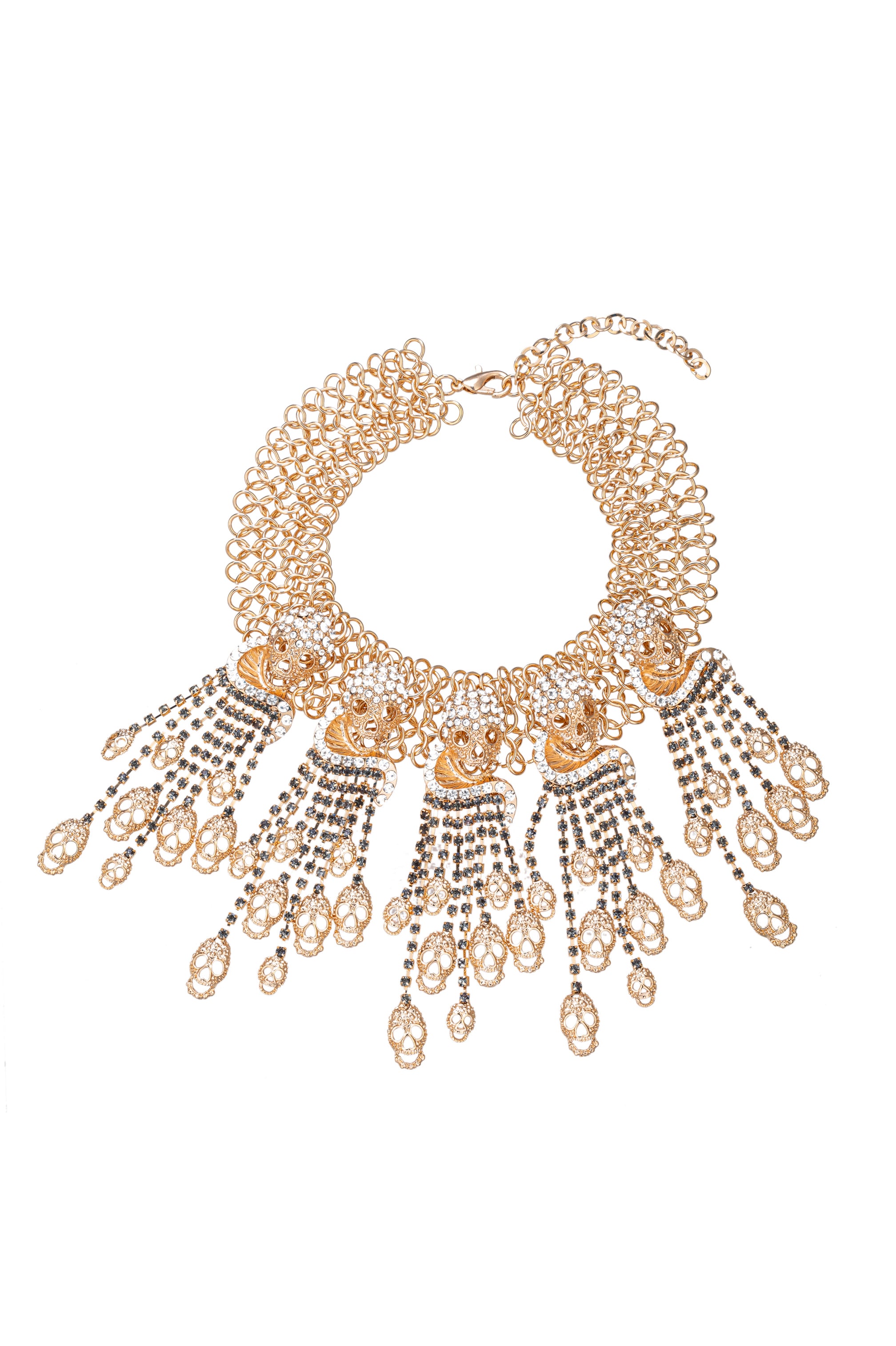 Gold tone alloy golden skull pendant necklace studded with glass crystals.