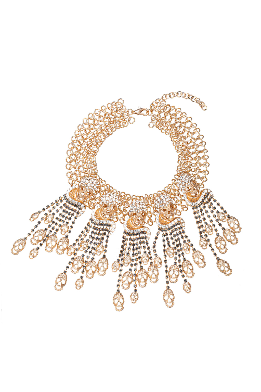 Gold tone alloy golden skull pendant necklace studded with glass crystals.