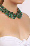 Green crystal collar necklace on model.