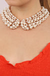 Gold pearl collar necklace on model