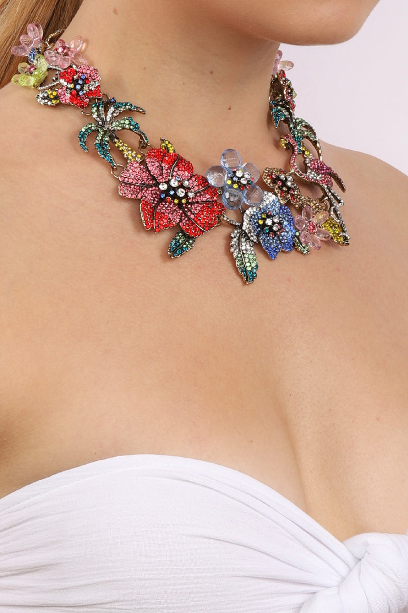 Colorful floral statement necklace shown on model