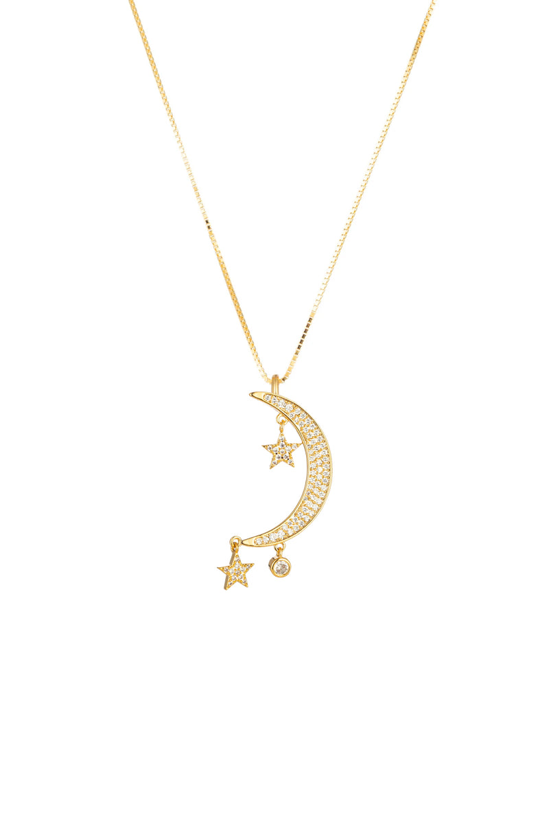 Mini moon and star pendant on a sterling silver necklace.