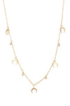 Gold tone brass necklace with brass charms.