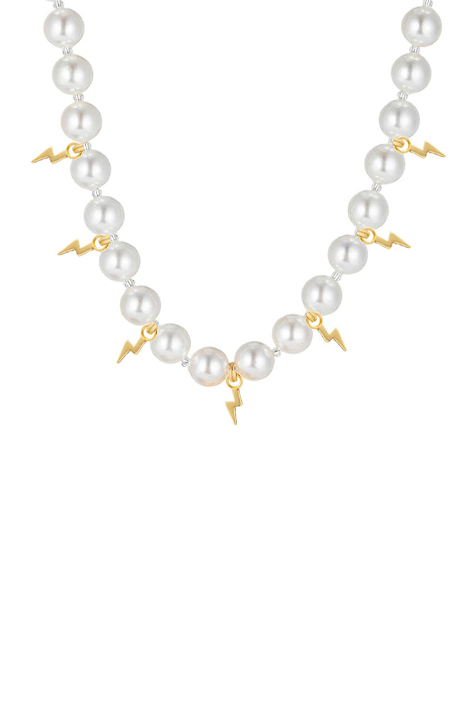 Shell pearl necklace with lightning bolt pendants.