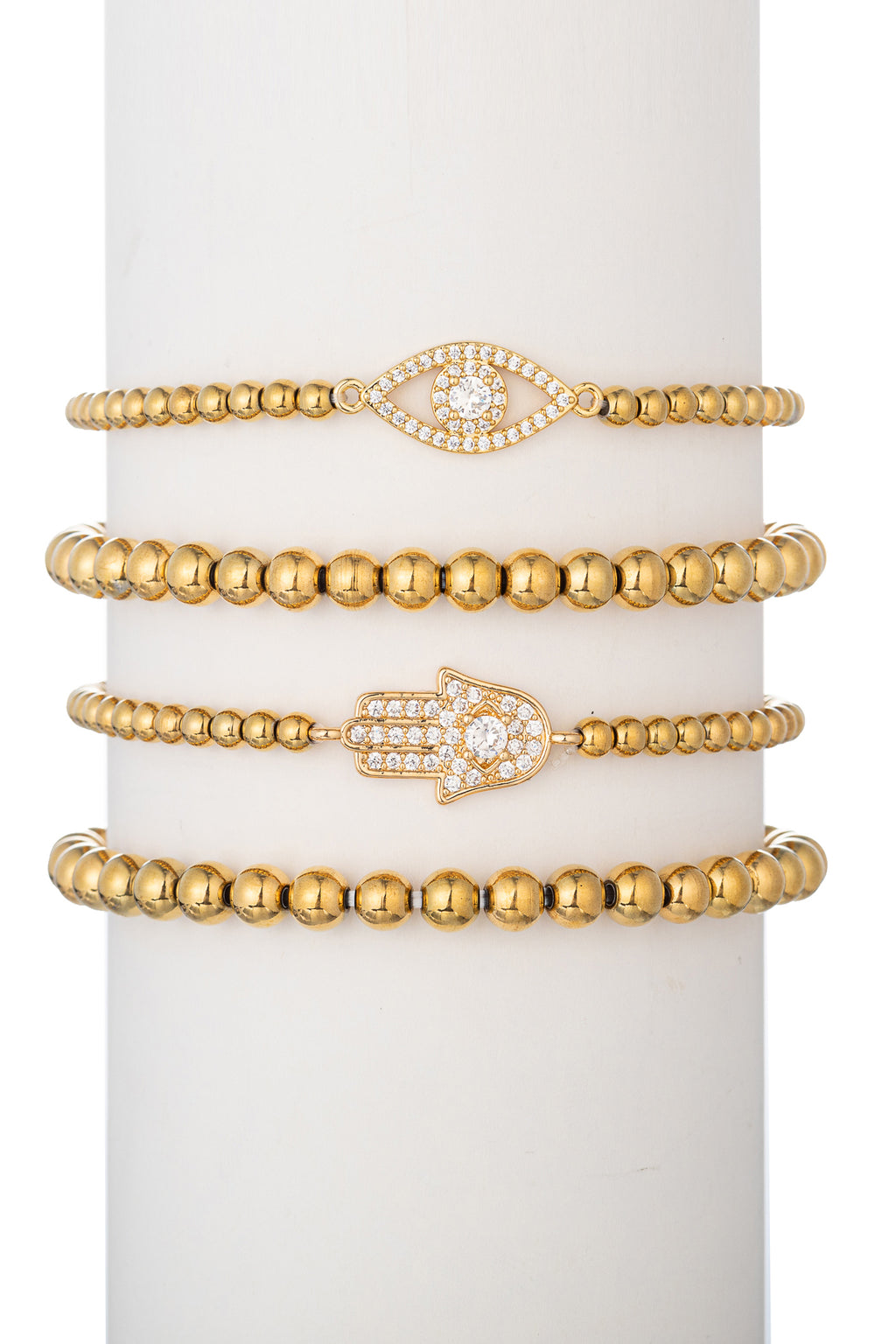 Gold tone titanium beaded bracelet set with CZ crystal evil eye and hamsa hand pendants.