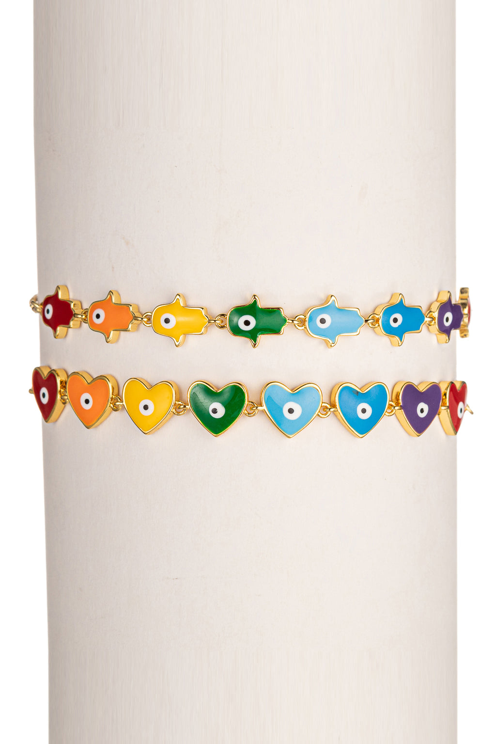 Gold tone brass bracelet set with rainbow heart & hamsa enamel pendants.