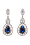 Silver tone brass statement drop earrings studded with a blue CZ crystal.