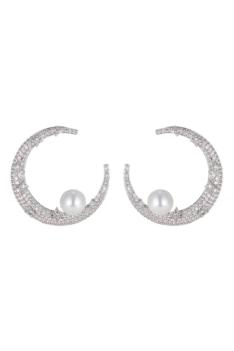 Silver crescent moon pearl earrings studded with CZ crystals.