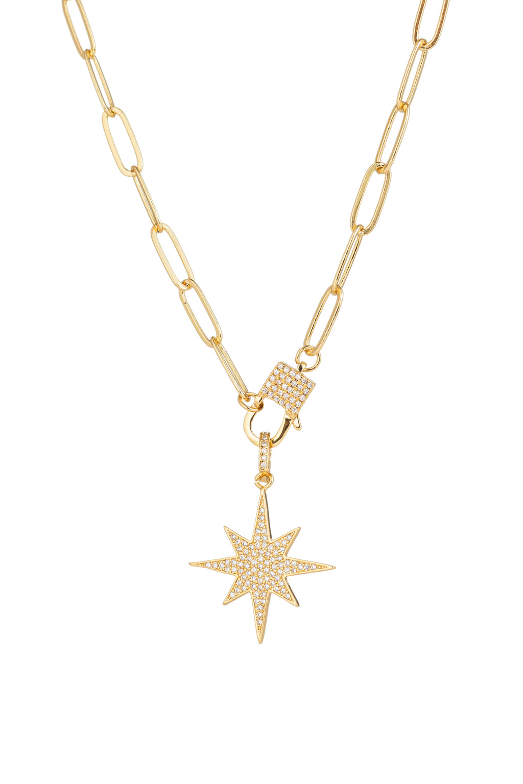 Sterling silver chain necklace with a brass North Star pendant that is studded with CZ crystals.