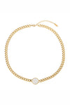 Gold tone titanium necklace with a coin pendant.