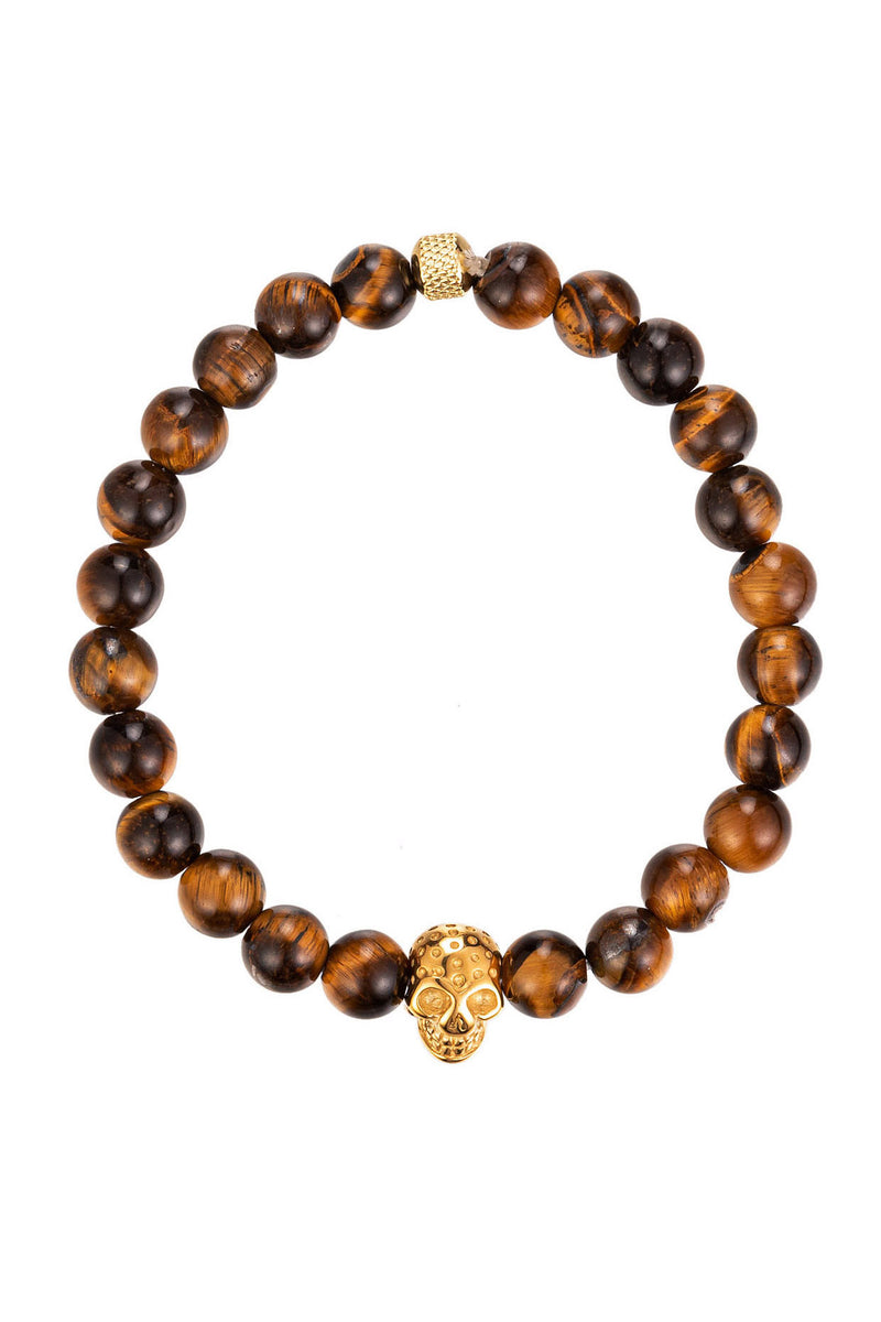 Gold tone titanium skull head on a tiger eye beaded bracelet.