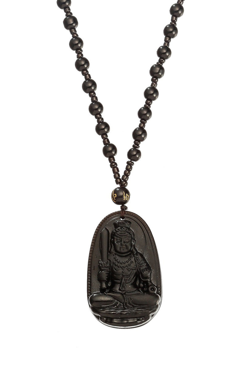Black jade necklace with a Buddha pendant.